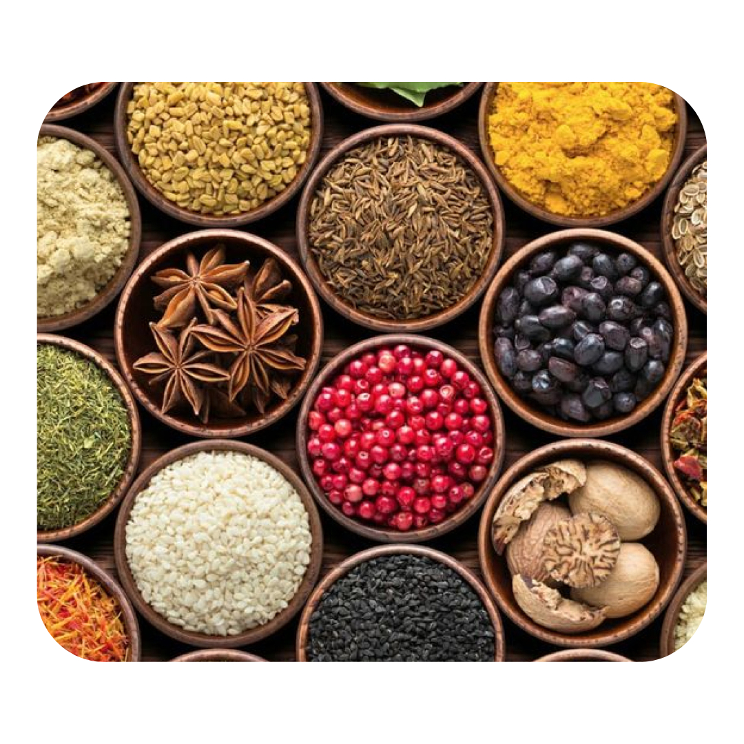 Various colorful spices in wooden bowls